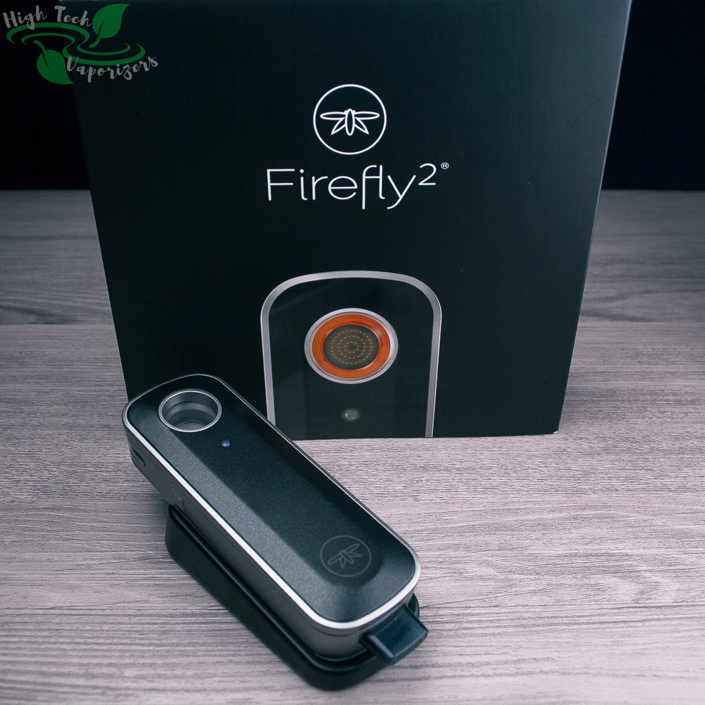 firefly 2 vaporizer on charging dock in front of box that it comes in